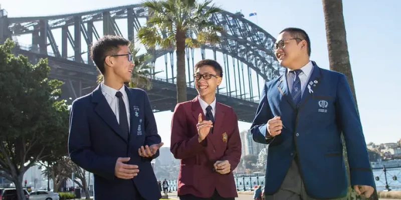 Happy students under harbour bridge