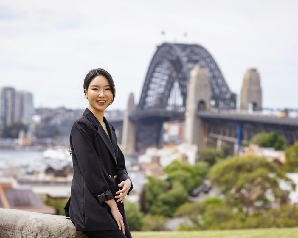 Student in front of Harbour bridge