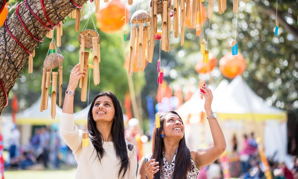 Two friends enjoying the decorations at parramasala festival in parramatta 2013