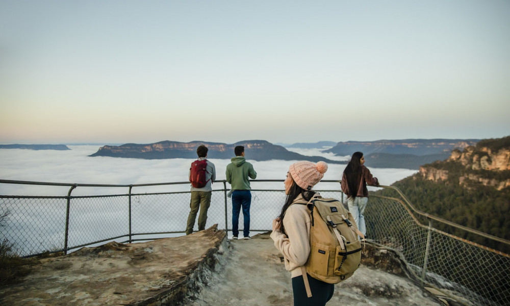 group of people at blue mountains olympian rock looking at NSW landscape