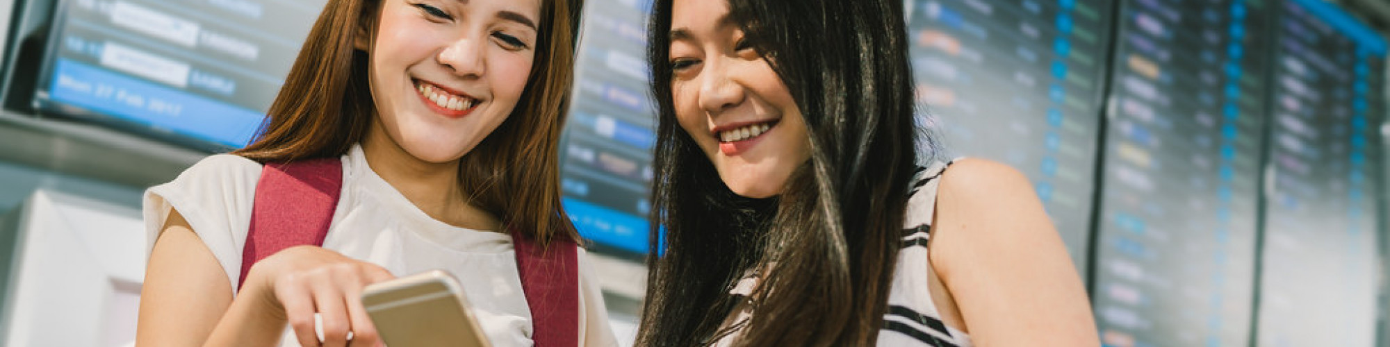 students at flight information board